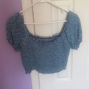 From Arie a blue flower print cropped top.